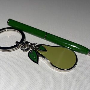 Coach Green Pear Keychain with a Green Coach Pen
